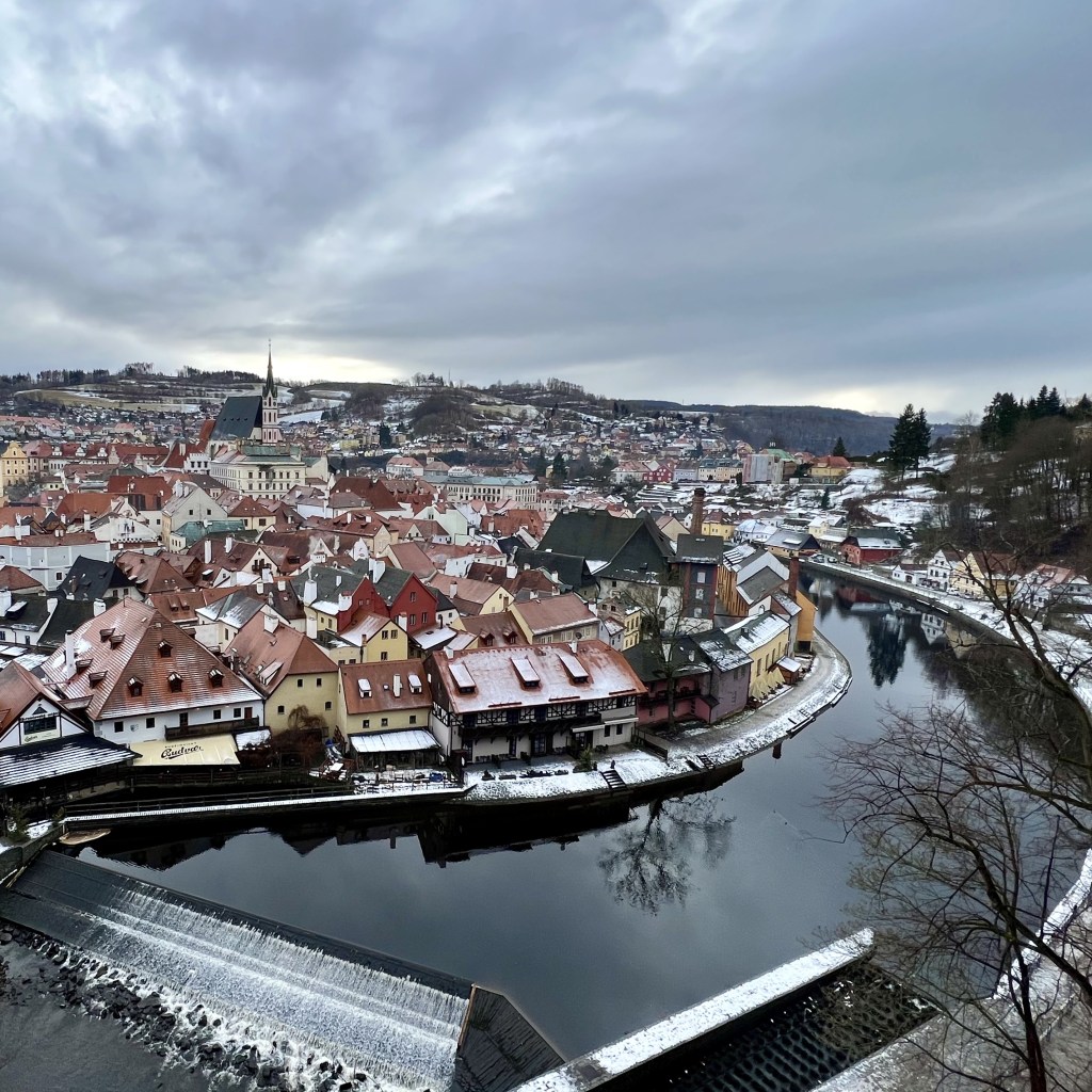 Snowy scenery of river bending around the town of Czesky Krumlov