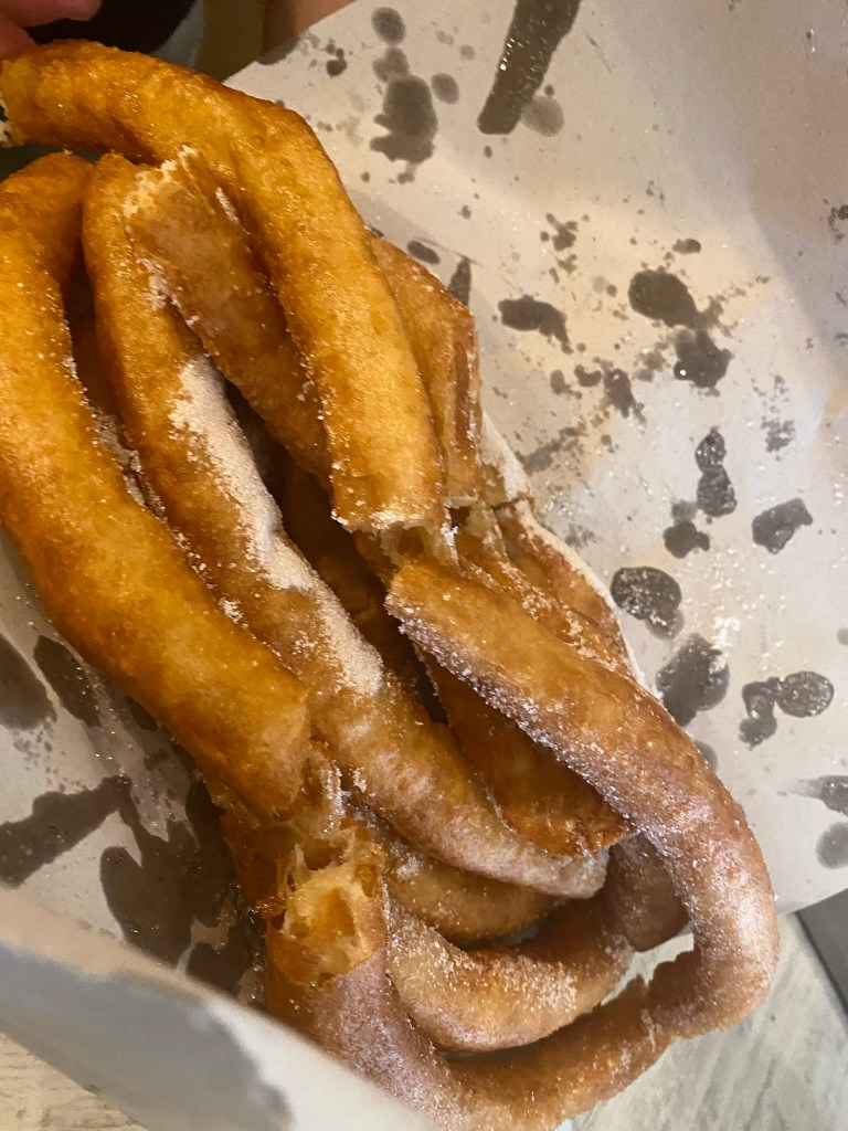 The spiral churros, after frying, cut into straight pieces